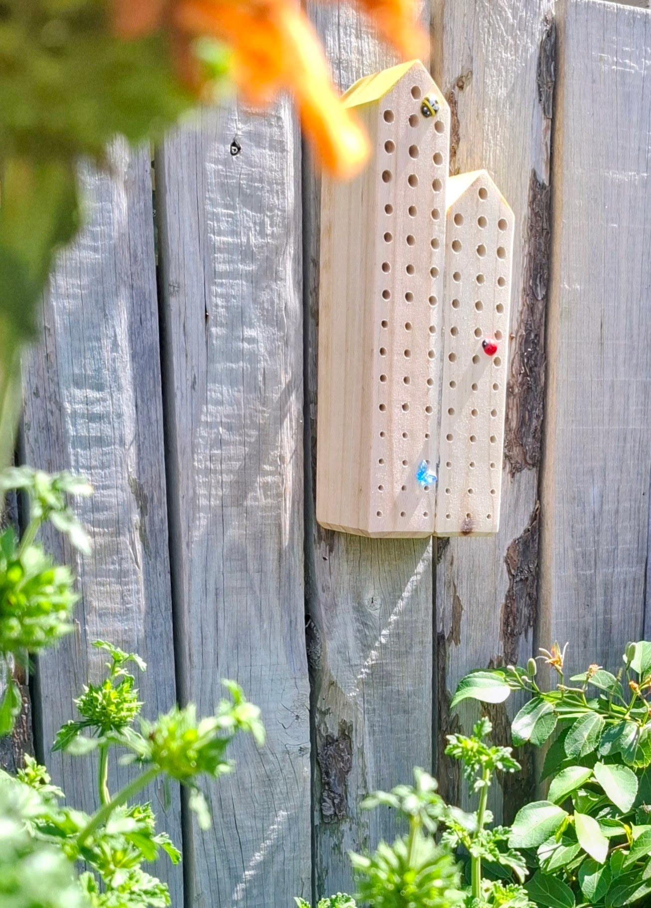 The Bee Hotel, mounted on its garden fence and ready for guests